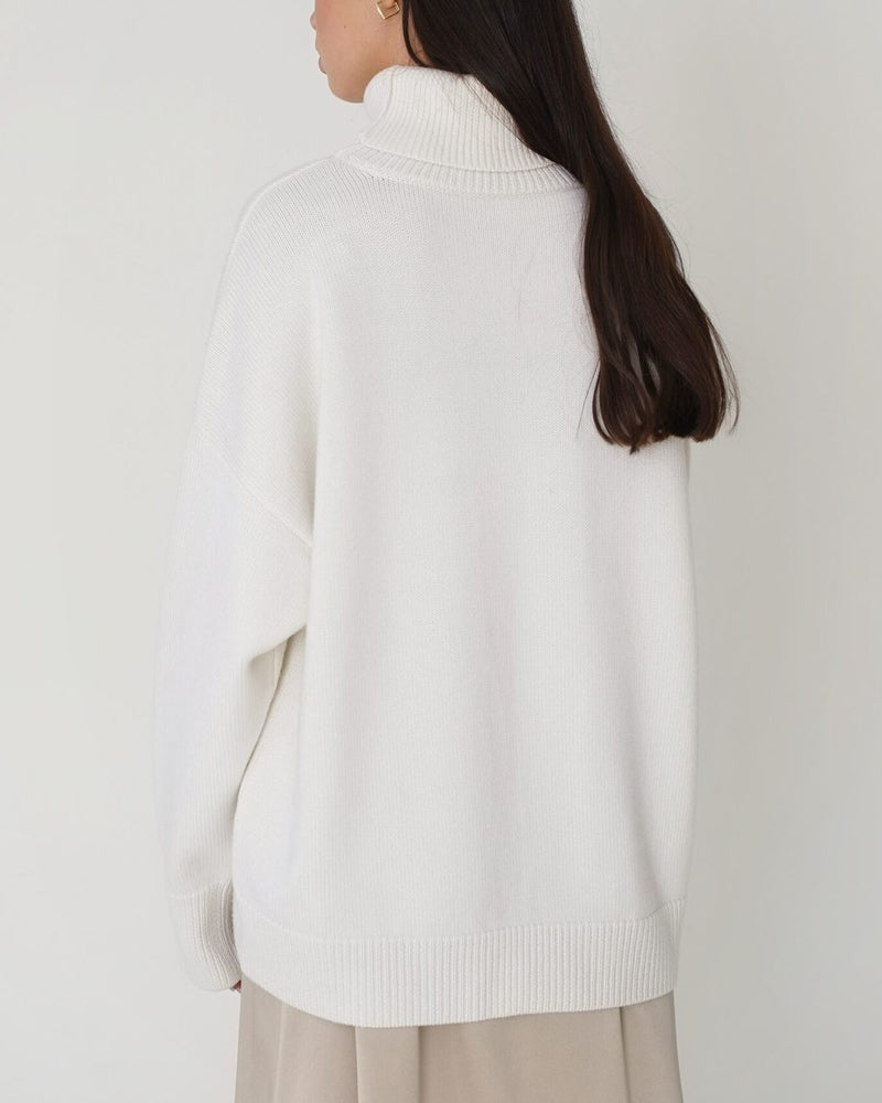 Comfortable women's cozy jumper, a relaxed fit roll neck sweater, ideal for winter fashion.
