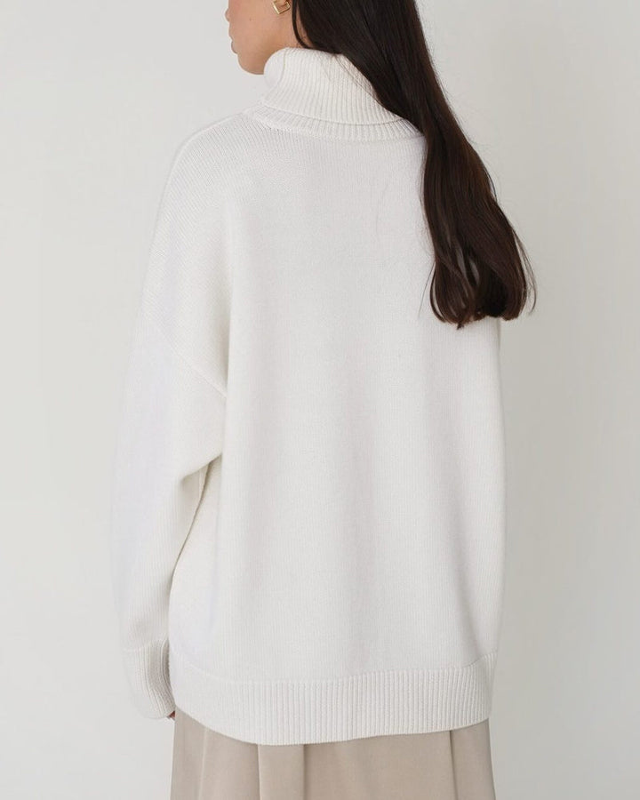 Comfortable women's cozy jumper, a relaxed fit roll neck sweater, ideal for winter fashion.