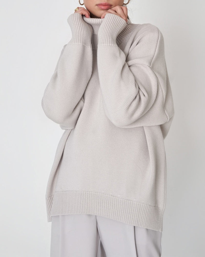 Soft women's cozy turtleneck jumper, offering a stylish relaxed fit & ultimate winter comfort.