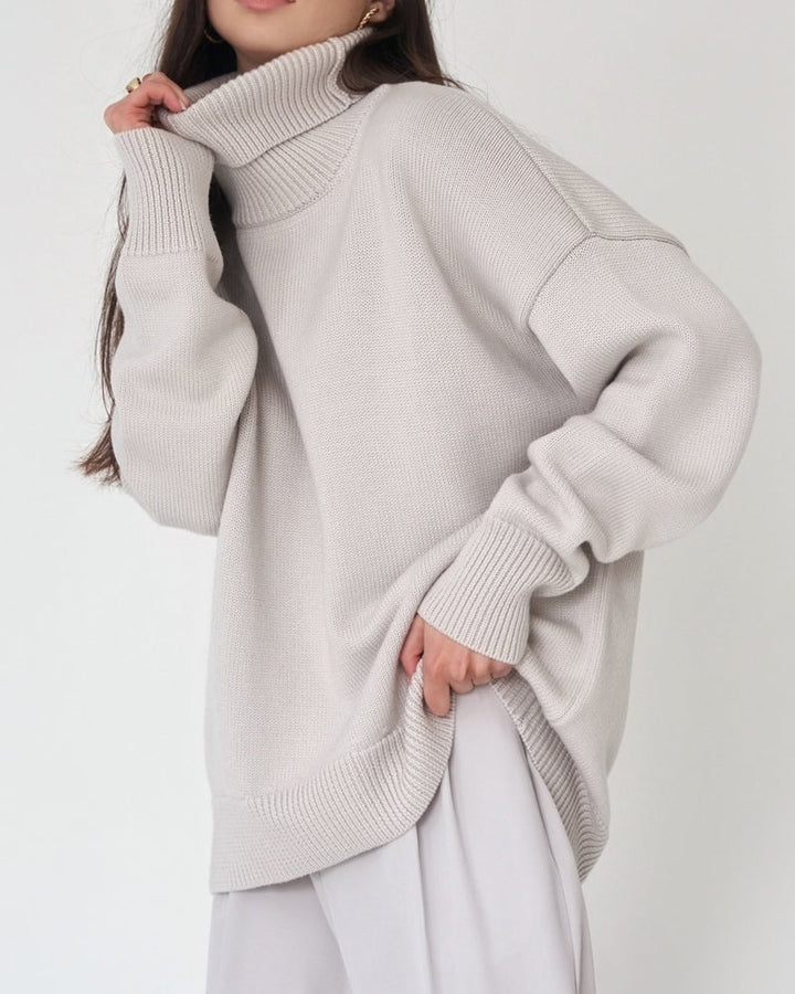 Chic oversized women's sweater, a comfy roll neck knit with a fashionable drop shoulder design.