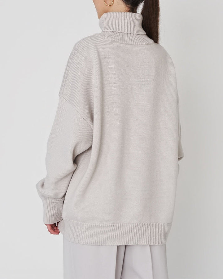 Women's warm oversized jumper, a cozy roll neck sweater perfect for stylish layering in winter.