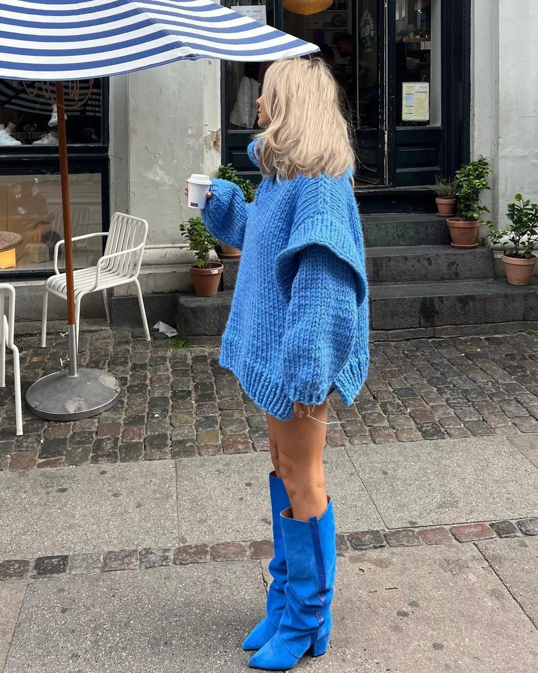 Relaxed fit women's oversized turtleneck mini dress, a stylish long sleeve sweater for chilly days.