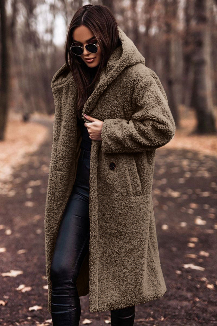Stylish women's relaxed fit hooded teddy longcoat, ideal casual outerwear for winter warmth.