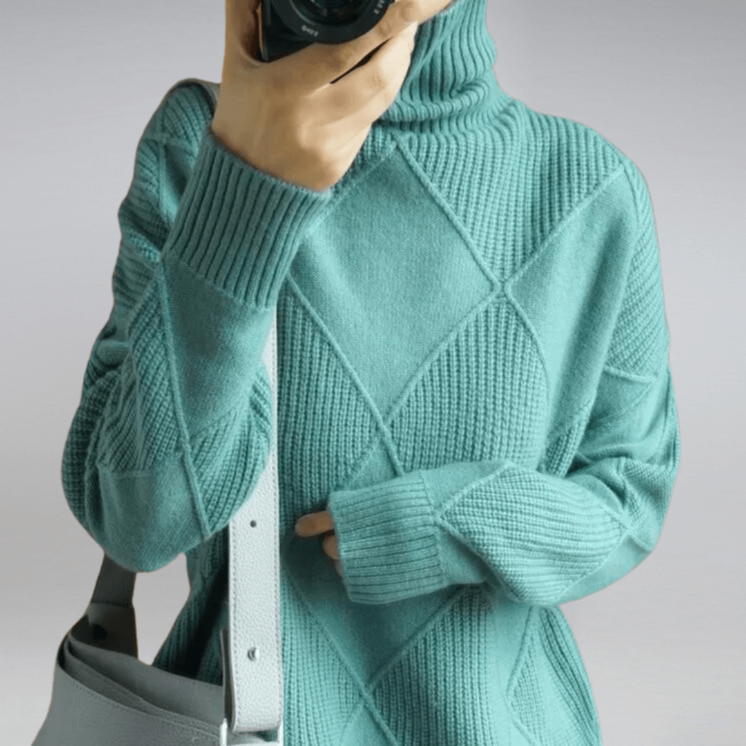 Stylish women's fall apparel: a cozy knit relaxed turtleneck sweater for warmth and comfort.