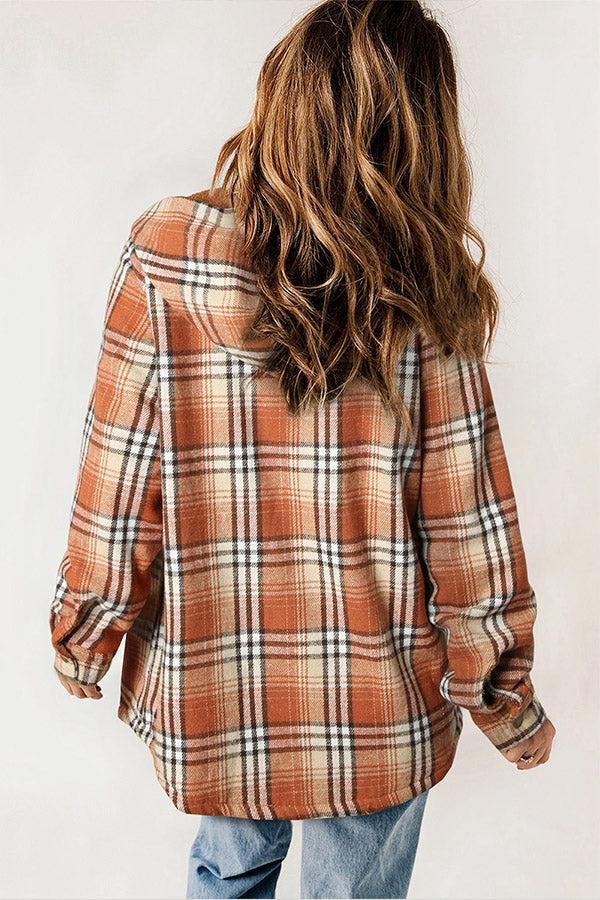 Women's warm Sherpa lined hooded flannel jacket, button-front, plaid design, for cozy winter wear.
