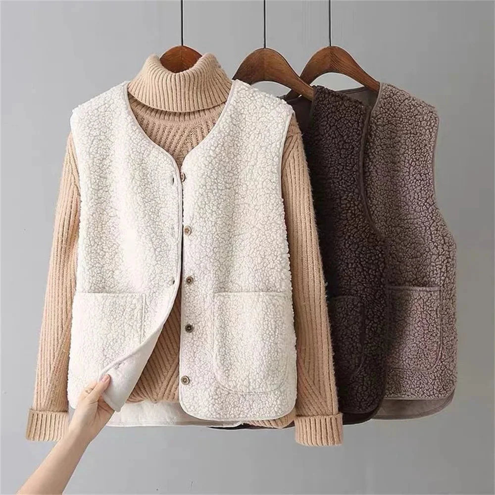 Women's cozy sherpa vest with button-front, V-neck, & patch pockets. Perfect for fall layering.