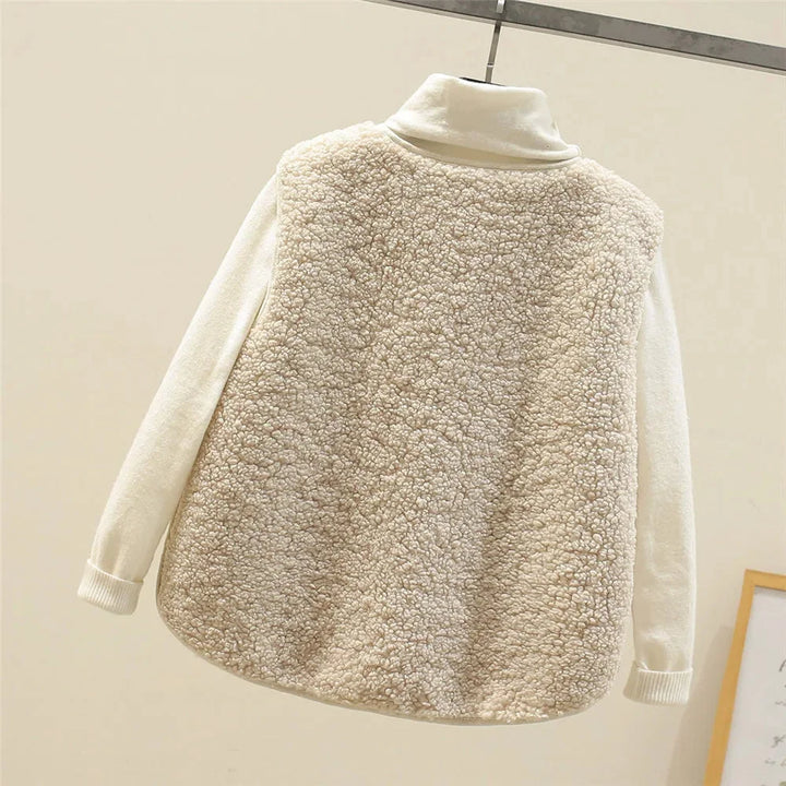 Women's cozy sherpa vest, button-front, V-neck, & practical patch pockets. Ideal for layering.
