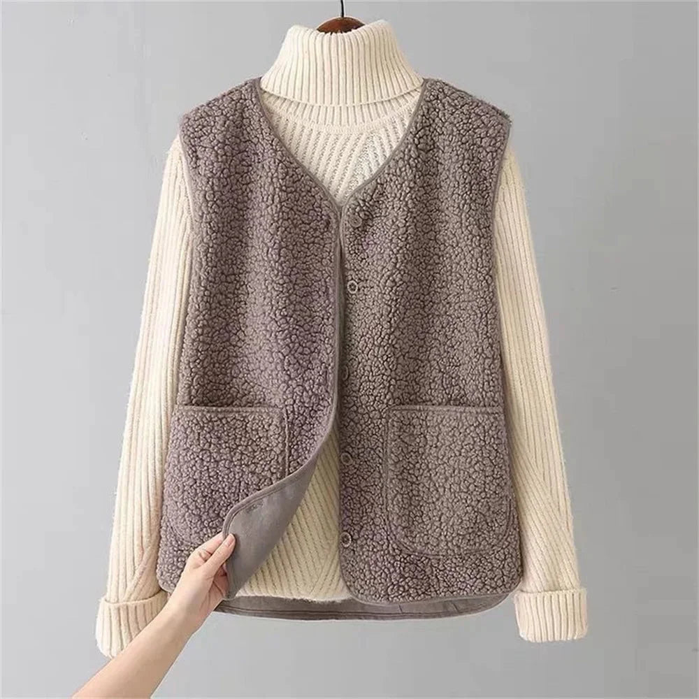 Soft sherpa vest for women, designed with a stylish button-front, V-neck, and useful patch pockets.