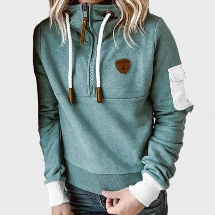Women's cozy soft grey hoodie with modern zip neck, perfect for casual loungewear.