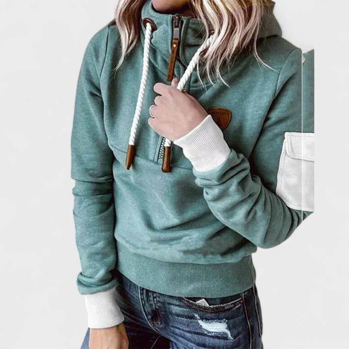 Soft women's green hoodie, comfortable loungewear with a modern zip neck. Cozy pullover.