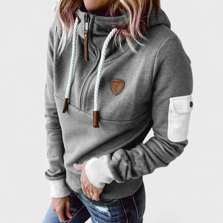 Women's stylish black zip neck hoodie paired casually. Soft, cozy, and comfortable loungewear.