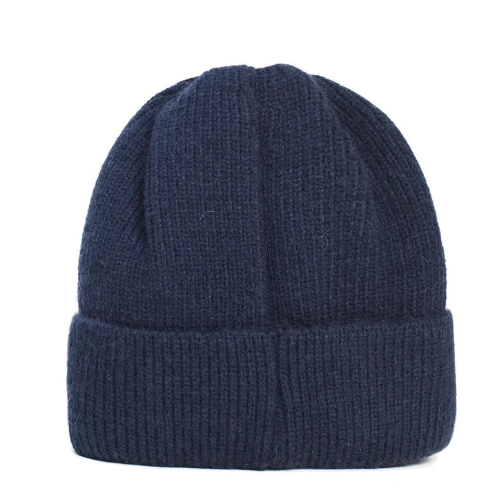 Fashionable women's beanie for cold weather, featuring a cozy knit, subtle sparkle, and a classic fold-over cuff.