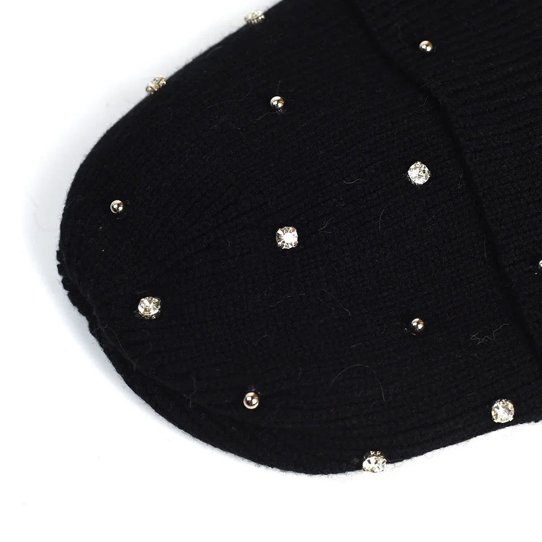 Soft knit women's beanie with a sparkling rhinestone embellishment and a protective fold-over cuff for winter.