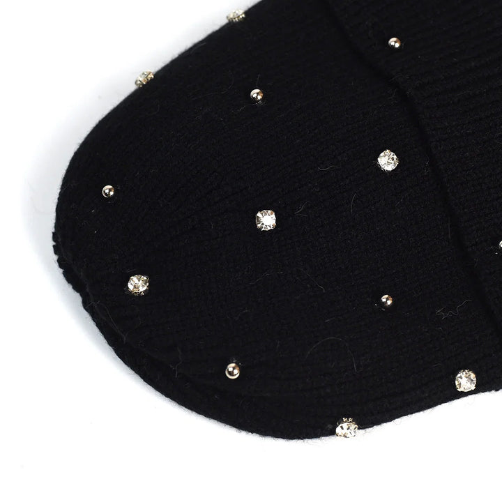 Soft knit women's beanie with a sparkling rhinestone embellishment and a protective fold-over cuff for winter.