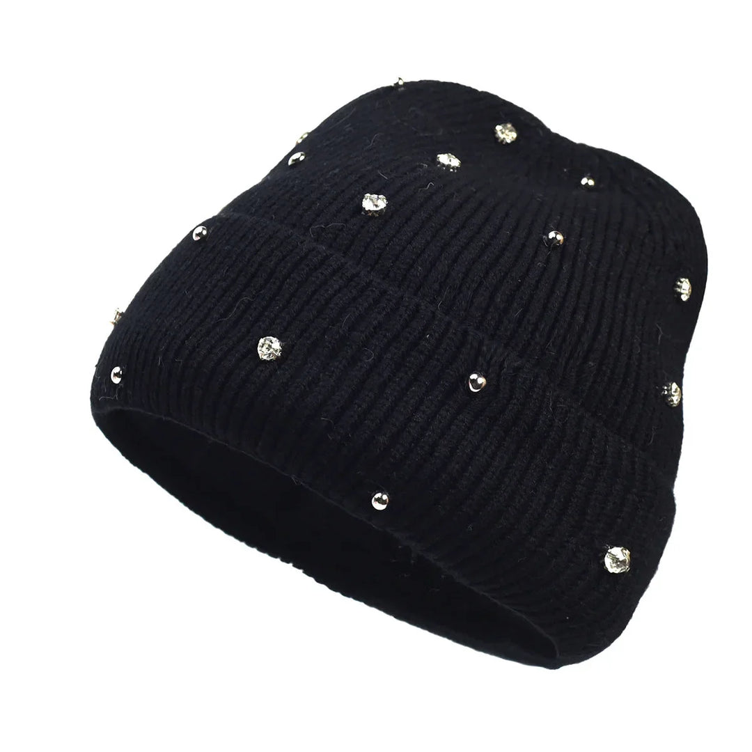 Chic women's winter beanie, a cozy, sparkly accessory with a trendy fold-over cuff, ideal for cold weather outfits.