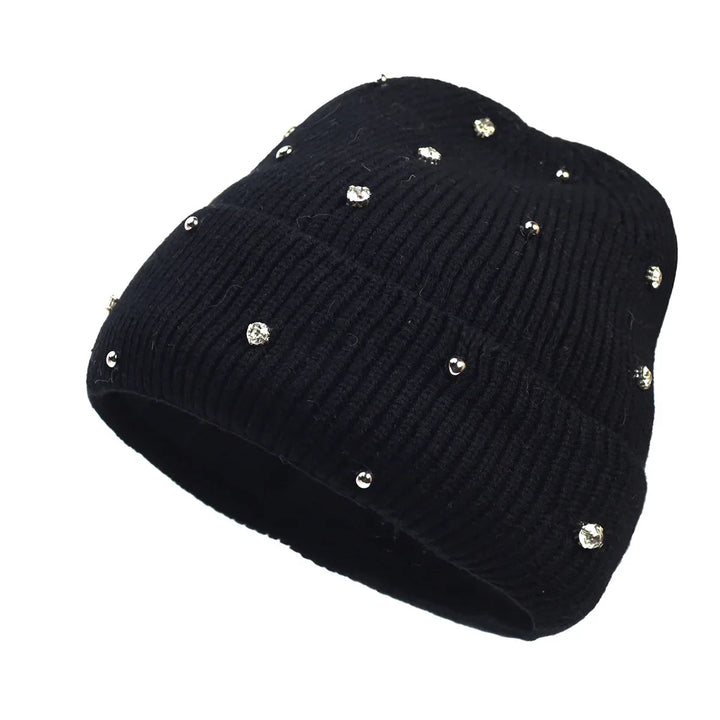 Chic women's winter beanie, a cozy, sparkly accessory with a trendy fold-over cuff, ideal for cold weather outfits.