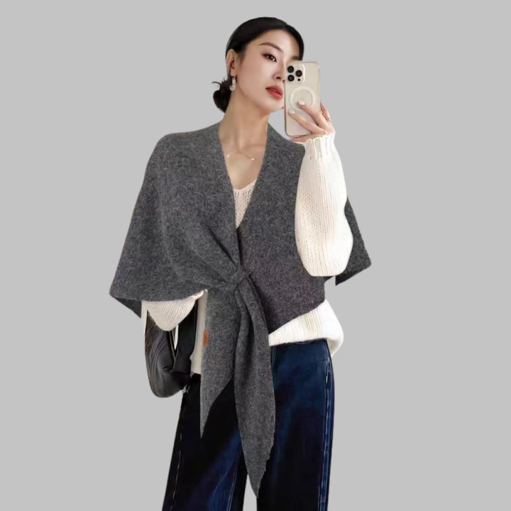 Elegant women's striped triangle shawl. Cozy, versatile fashion wrap for stylish layering.