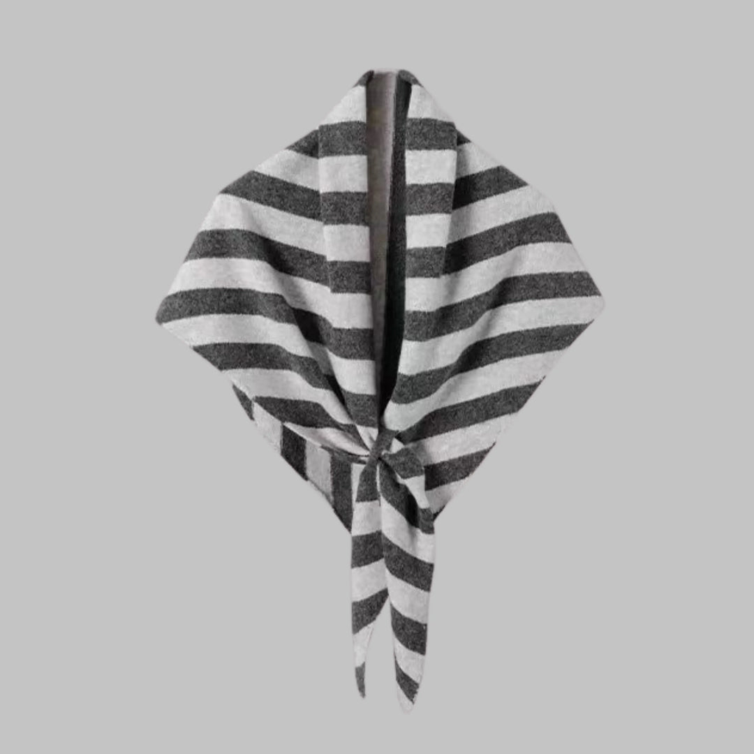 Chic striped triangle shawl for women. Cozy and versatile wrap, ideal for layering fashion.