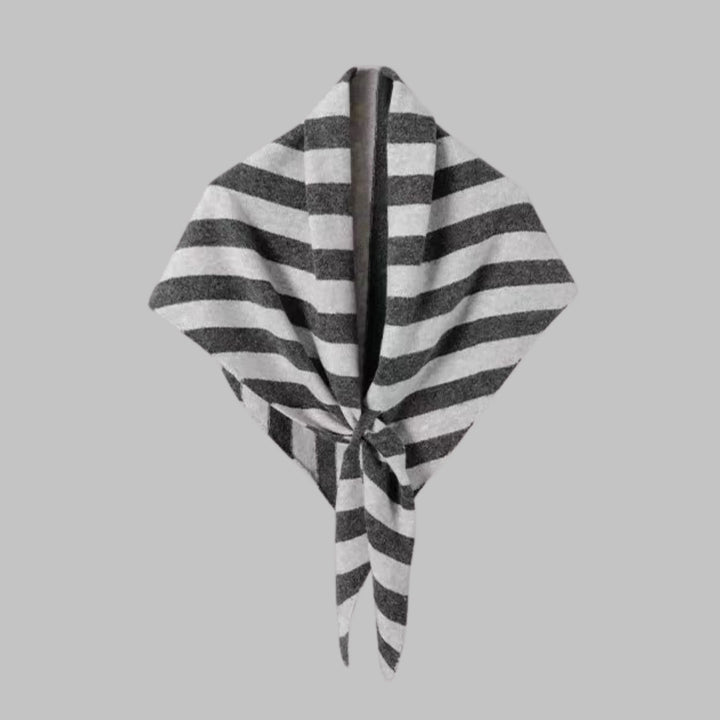 Chic striped triangle shawl for women. Cozy and versatile wrap, ideal for layering fashion.