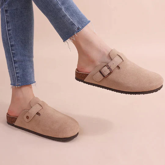 Women's cozy suede slip-on slippers with orthopedic cork insoles for comfort.