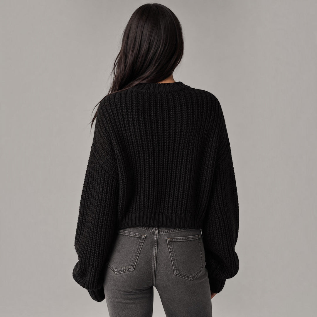 Oversized women's cozy cardigan, thick knit sweater providing warmth for autumn and winter comfort.