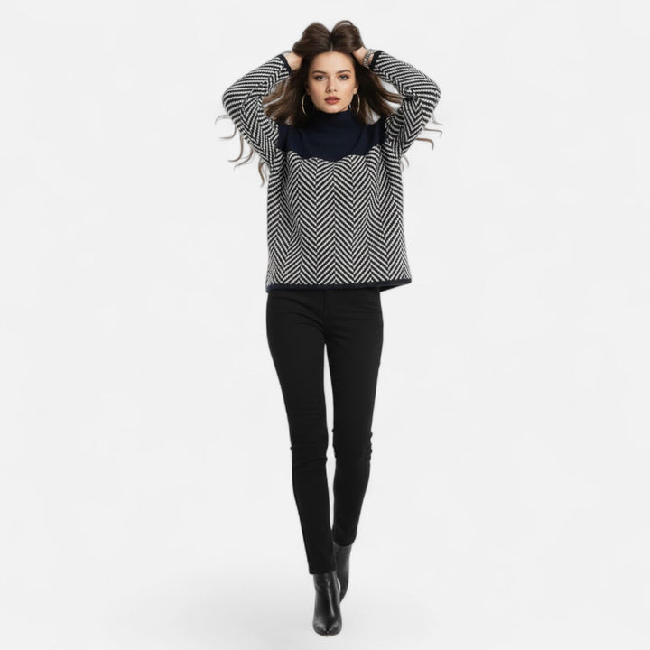 Close-up of a women's cozy pullover, showcasing its soft texture and warm turtleneck.