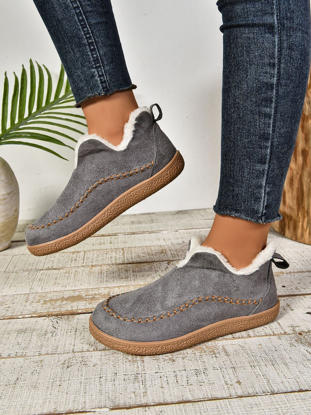 Comfortable women's slippers with plush lining, easy slip-on design.