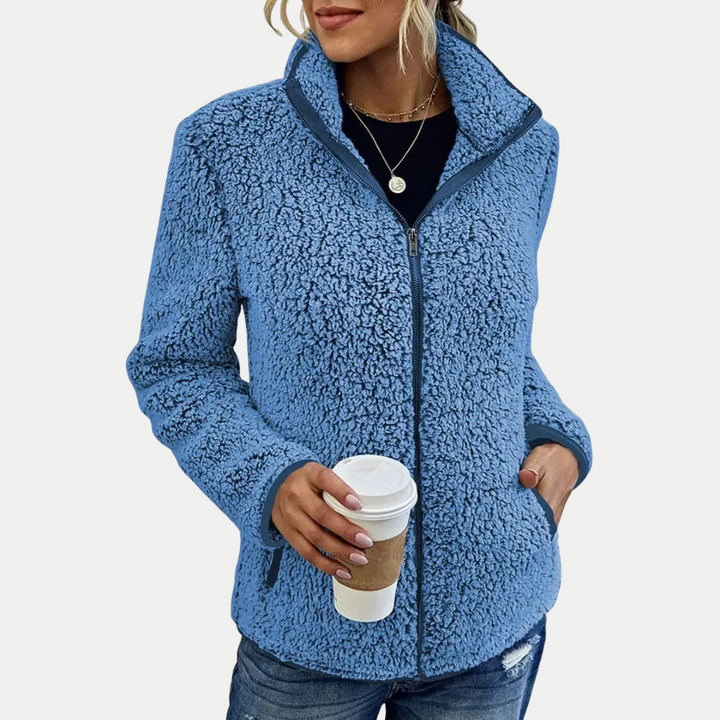 Women's cozy zip-up jacket with elegant textured pattern, perfect for fall layering.