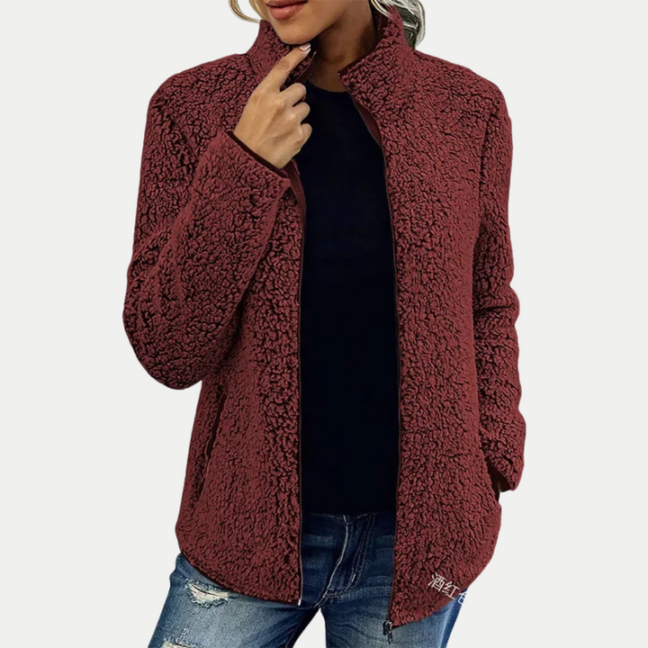 Stylish women's fleece zip-up jacket. Features a high collar & side pockets for comfortable casual wear.
