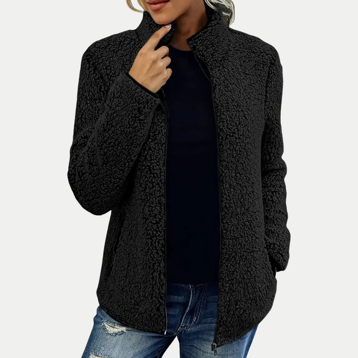 Elegant women's textured fleece zip-up jacket, designed for comfortable everyday casual wear.