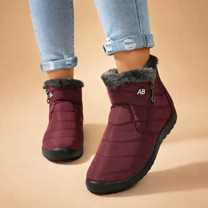 Women's warm winter boots. Cozy ankle-high zip-up design for ultimate cold weather warmth and fashion.