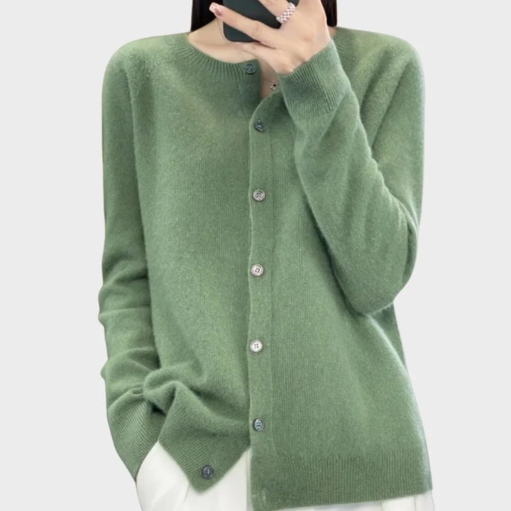 Women's cream crew-neck knit cardigan sweater with buttons, perfect for elegant layering or casual fall wear.