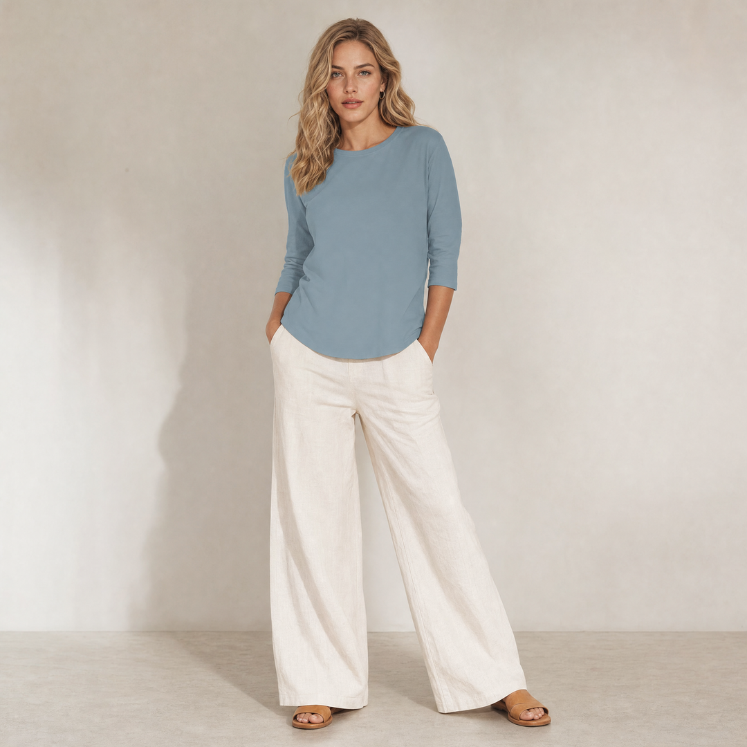 Comfortable women's crew neck top with 3/4 sleeves & a curved hem. Great for everyday style.