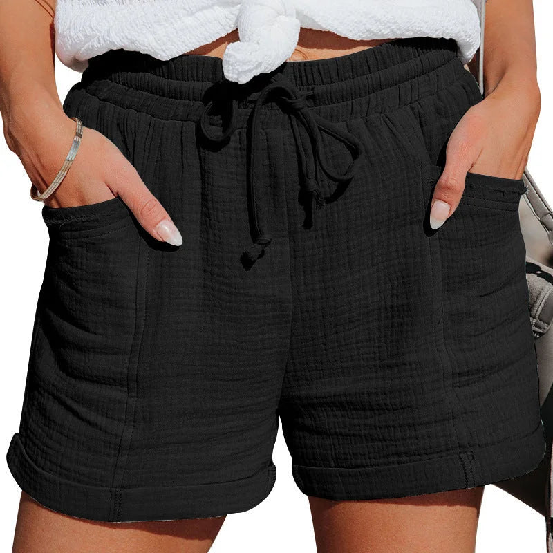 Front view of women's crinkled casual shorts with drawstring waist and cuffed hem for summer.
