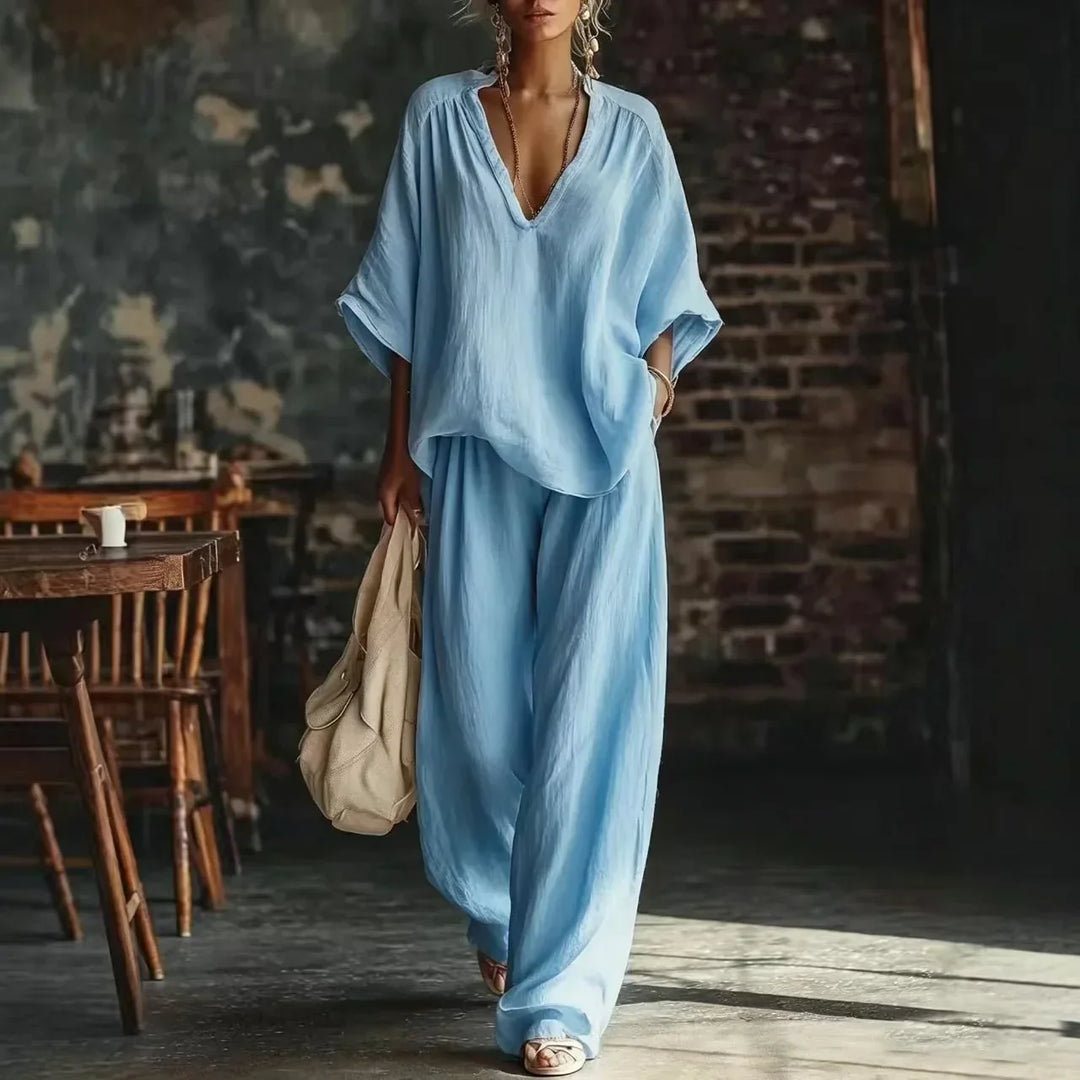 Soft crinkled fabric women's lounge set featuring a plunging top & wide-leg pants. Cozy two-piece for women.
