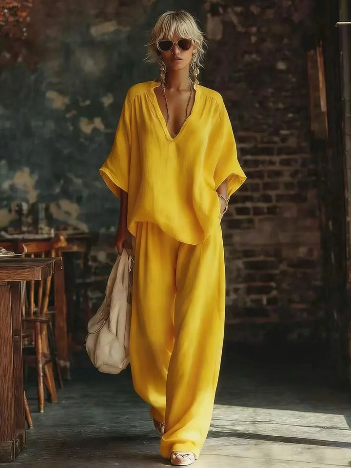Chic women's plunging top & wide-leg pant set. Crinkled two-piece lounge wear for a stylish, relaxed fit.