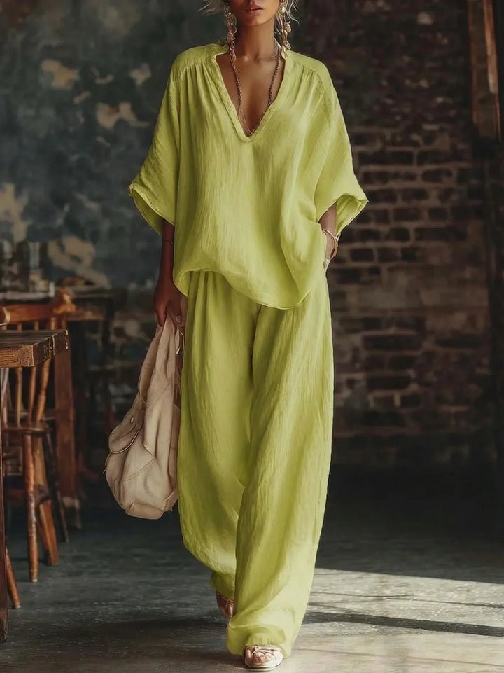 Women's crinkled lounge set: plunging top paired with wide-leg pants. A stylish and comfortable two-piece outfit.
