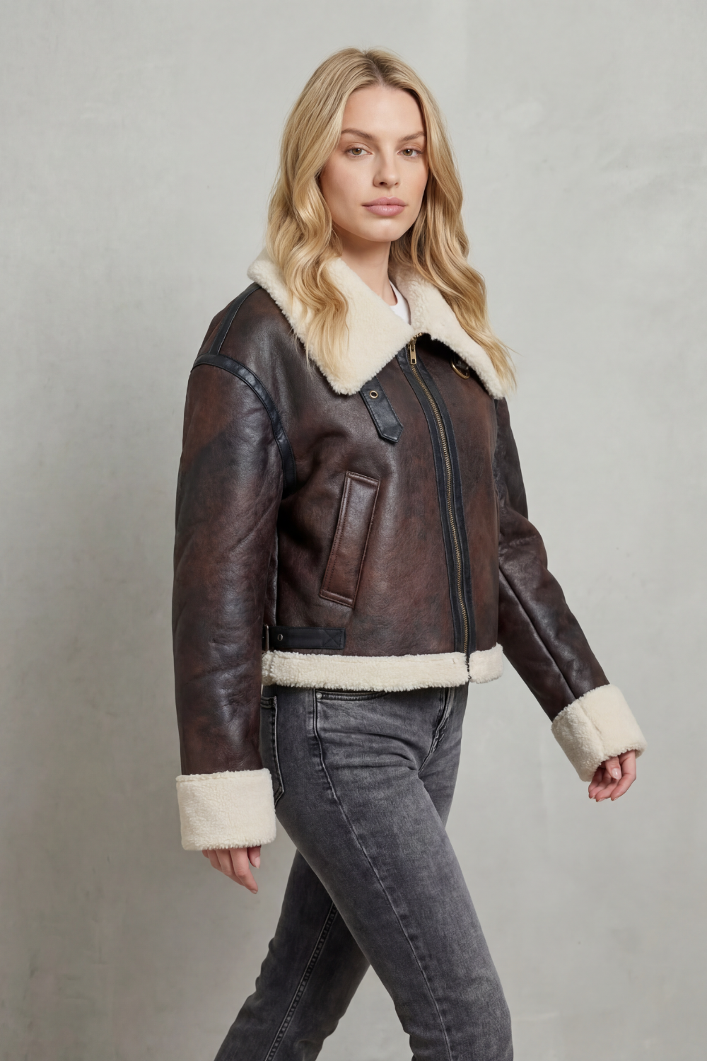 Chic women's cropped aviator jacket with soft, cozy trim, a trendy outerwear piece for fall and winter.