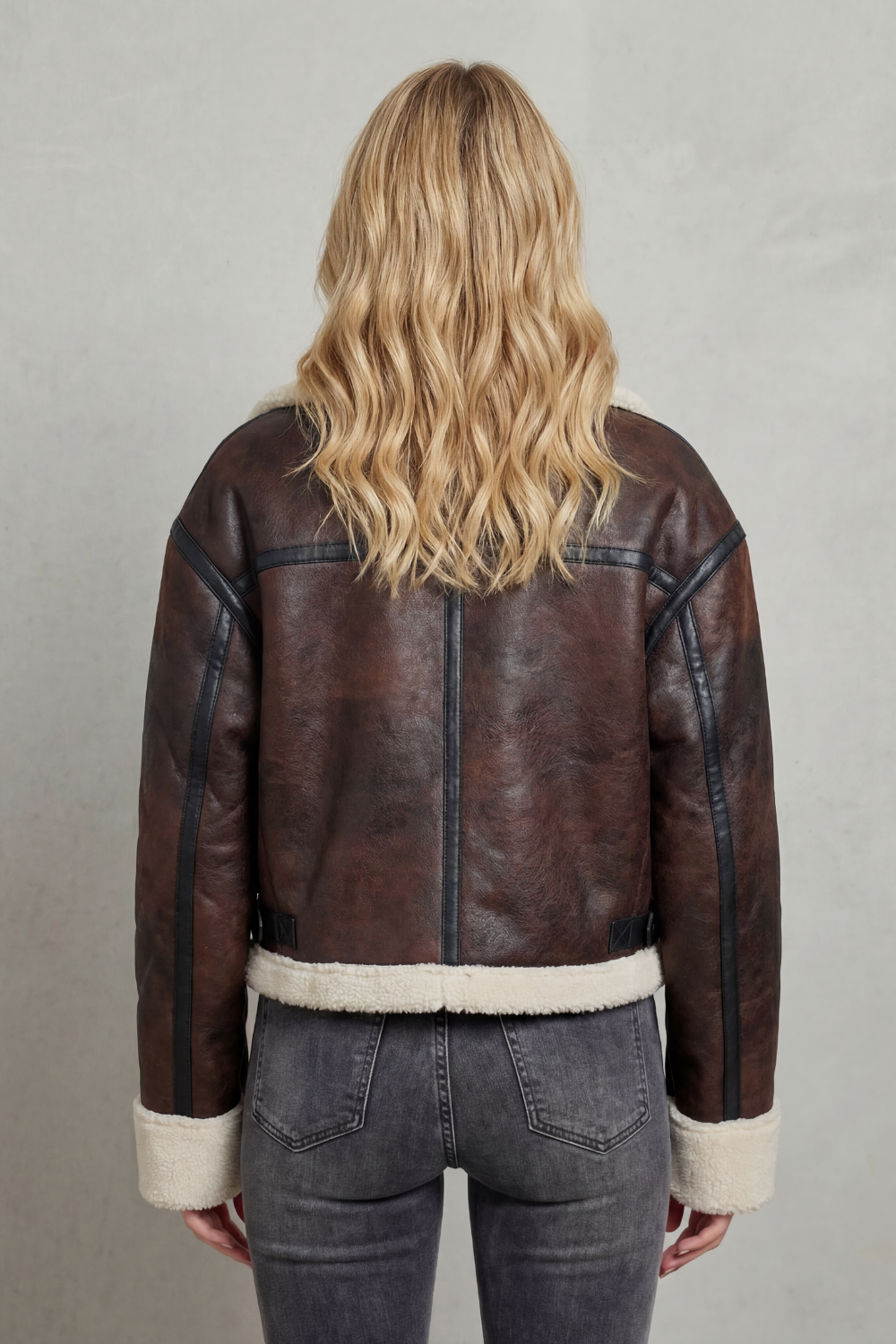 Fashionable women's cropped aviator jacket with plush cozy trim, great for adding warmth & style to outfits.