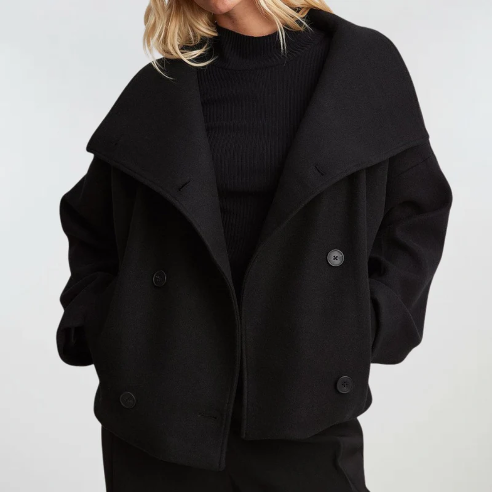Women's cropped double-breasted coat with a wide lapel, stylish and chic outerwear for fall fashion.