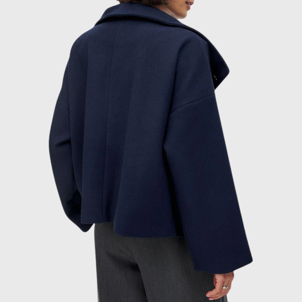 Sophisticated women's cropped double-breasted outerwear, featuring a stylish wide lapel for elegance.