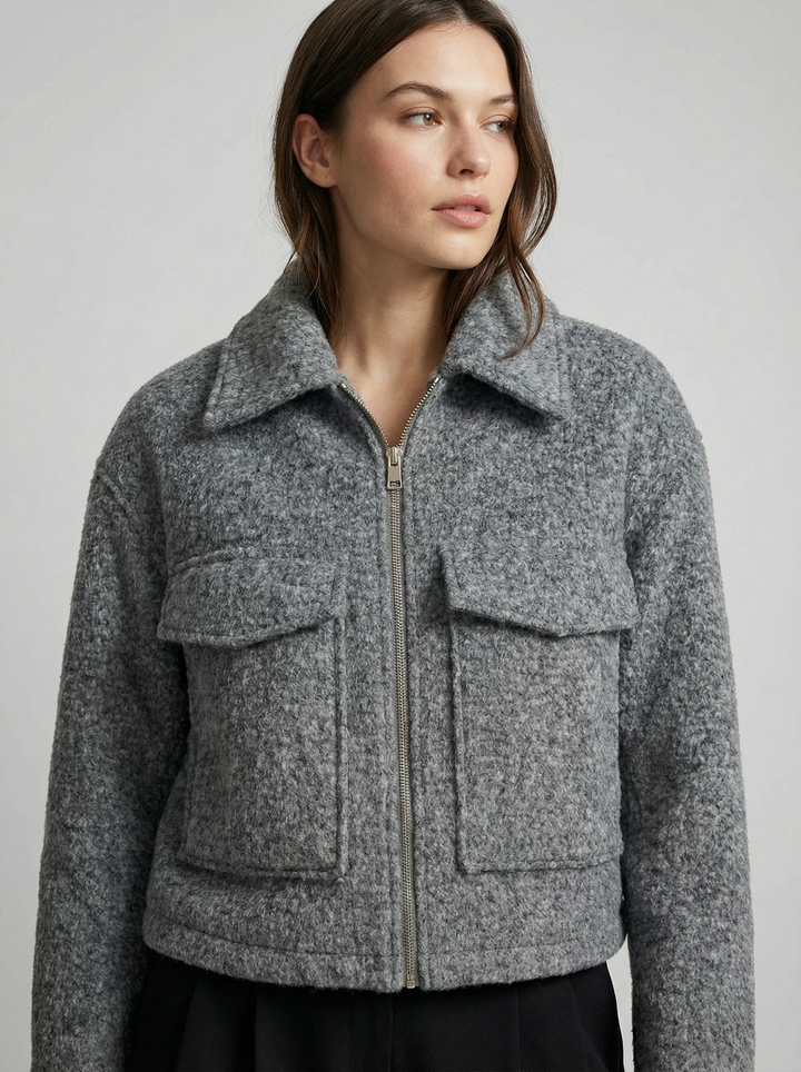 Women's cropped gray zip jacket with convenient front pockets. Casual chic outerwear for spring/autumn.