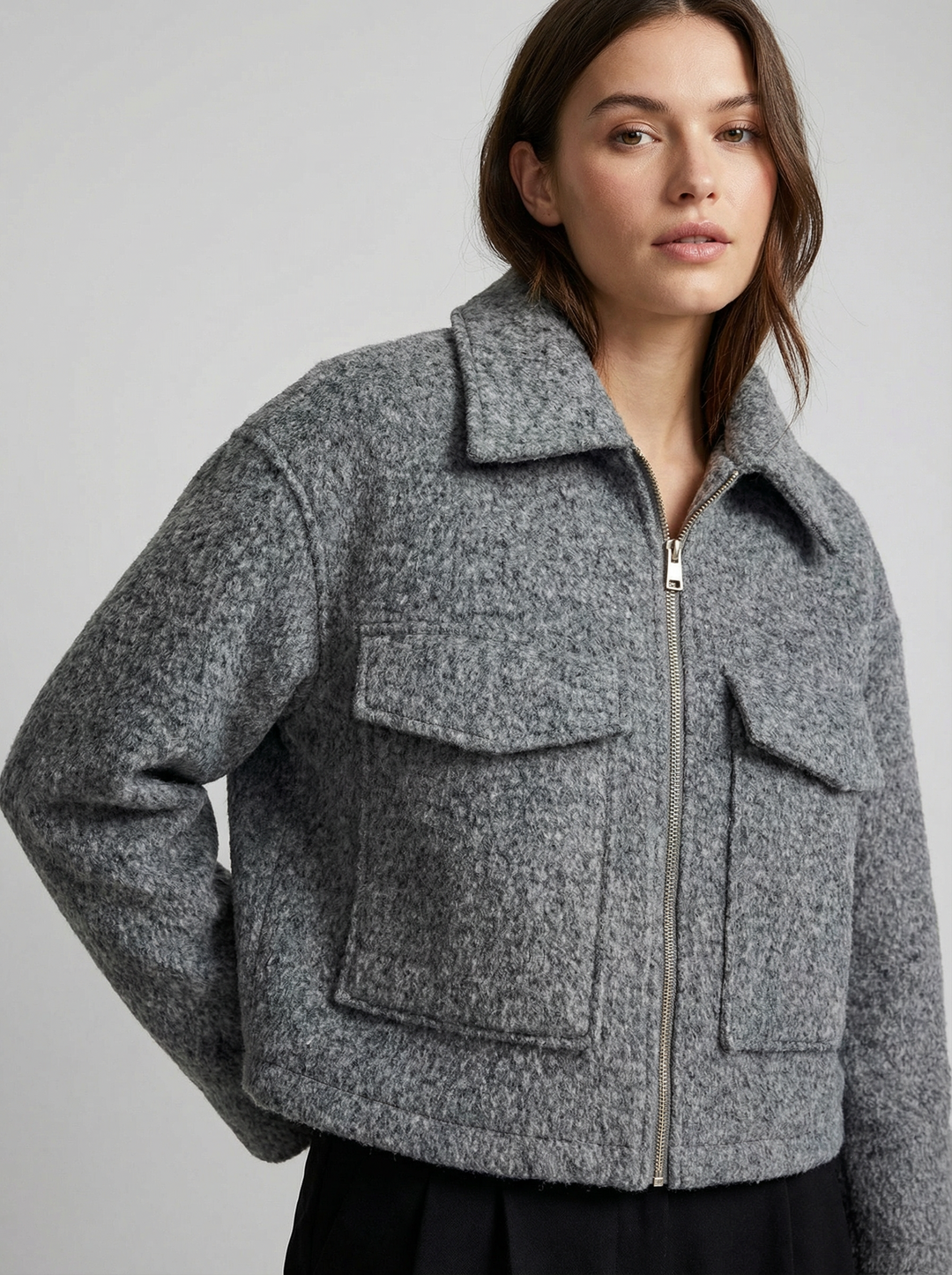 Fashionable women's gray cropped zip jacket with pockets. Ideal for spring & autumn casual chic outfits.