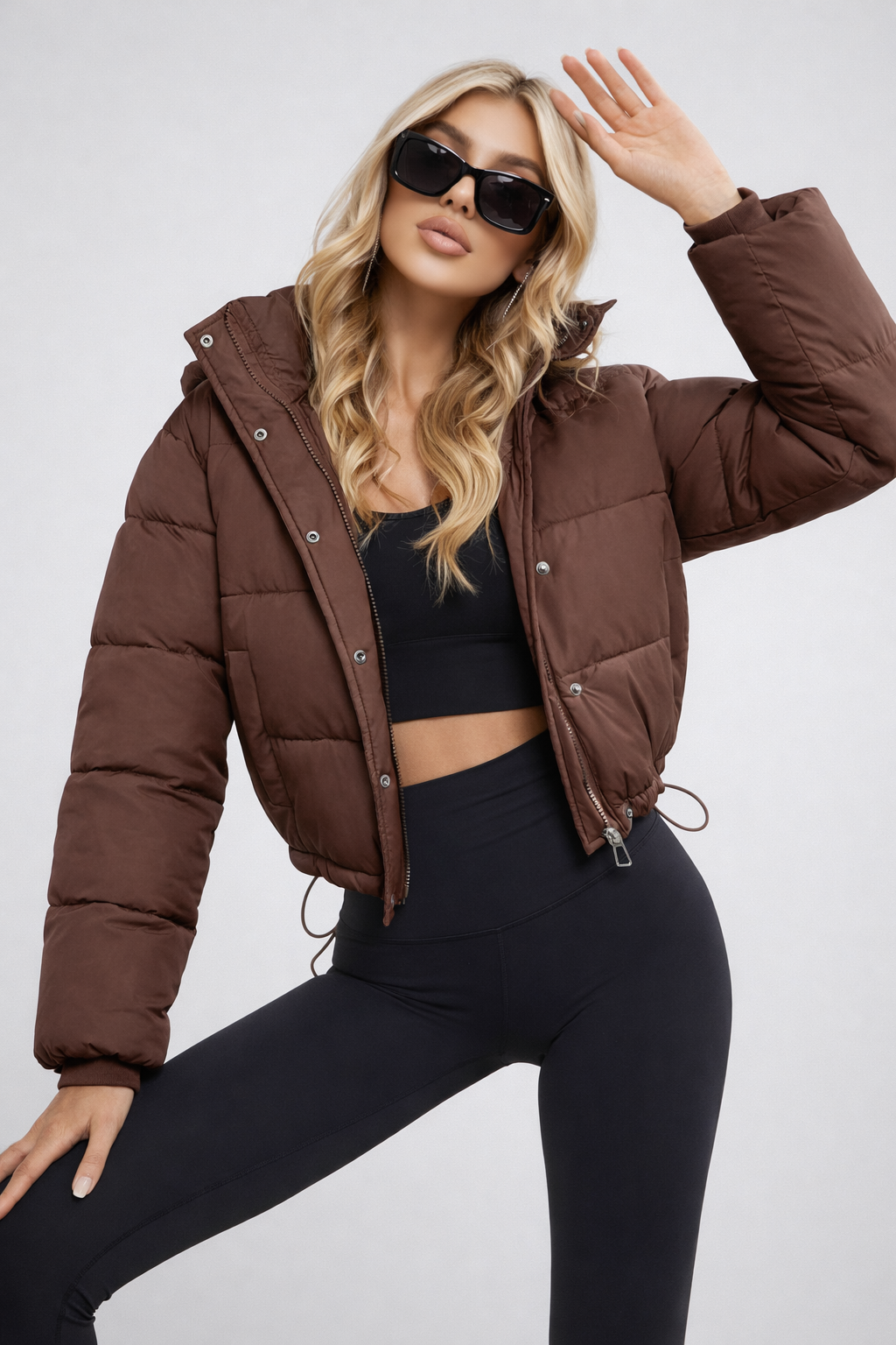 Women's cropped hooded puffer jacket in black, a stylish lightweight winter fashion essential.
