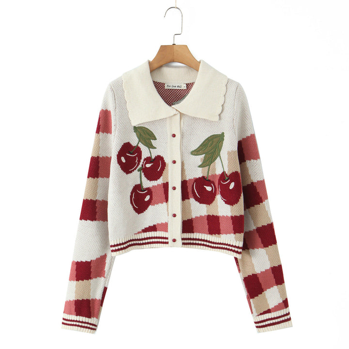Versatile women's spring fashion: a floral print cropped knit jacket in cherry blossom motif.