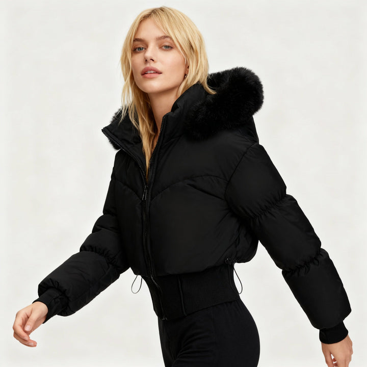Women's cropped puffer jacket with cozy faux fur hood. Stylish & warm winter outerwear.