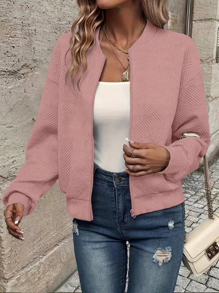 Stylish women's cropped quilted bomber jacket, a versatile layering piece for spring and autumn fashion.