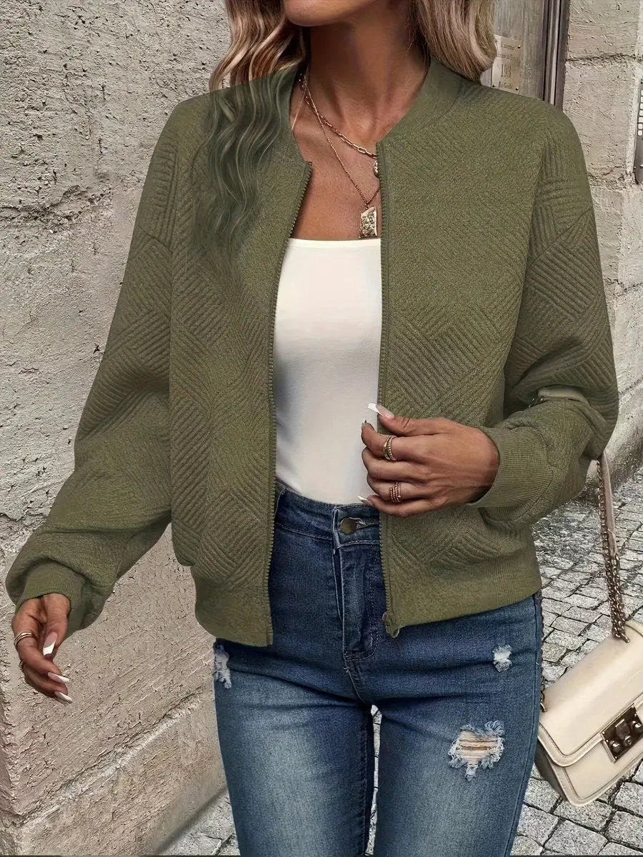 Zip-up cropped quilted bomber jacket for women, offering lightweight warmth and textured everyday style.