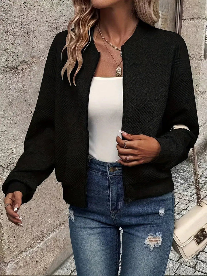 Spring outerwear: women's light cropped quilted bomber jacket, ideal for casual layering & autumn fashion.