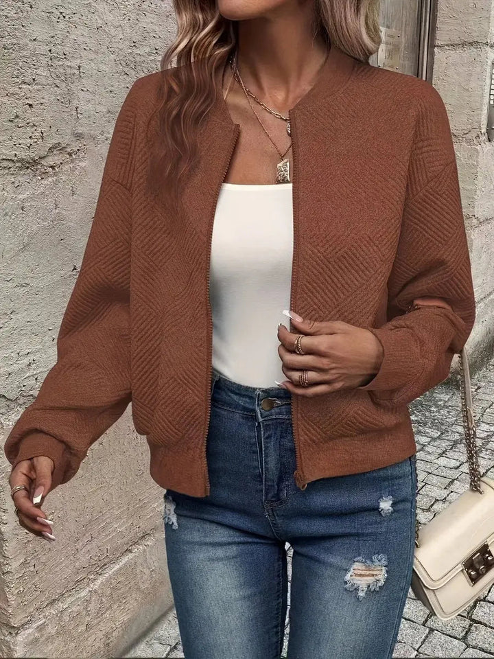 Layering cropped quilted bomber jacket, a women's zip-up perfect for spring and autumn casual outfits.